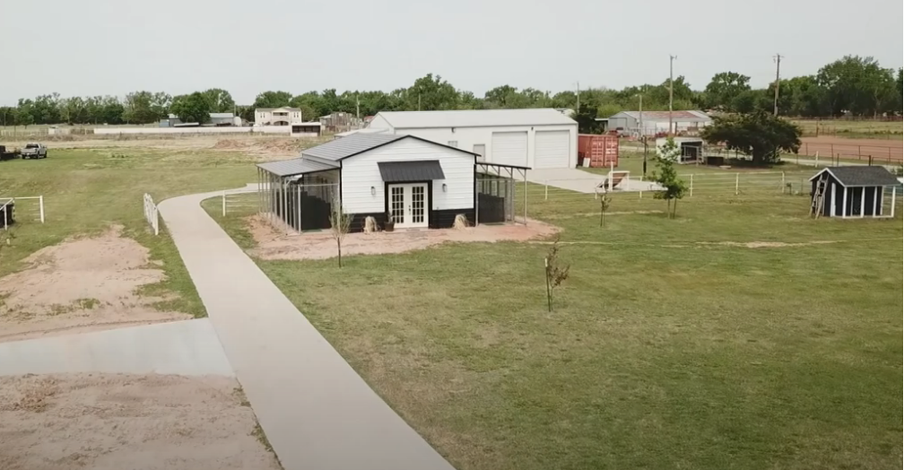 Load video: Aerial view of The Doggie Dorm facility and grounds